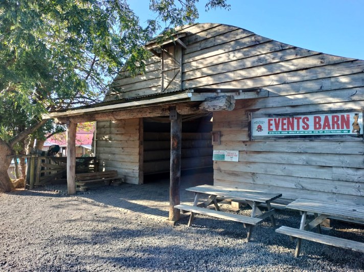 The Events Barn with picnic tables out front