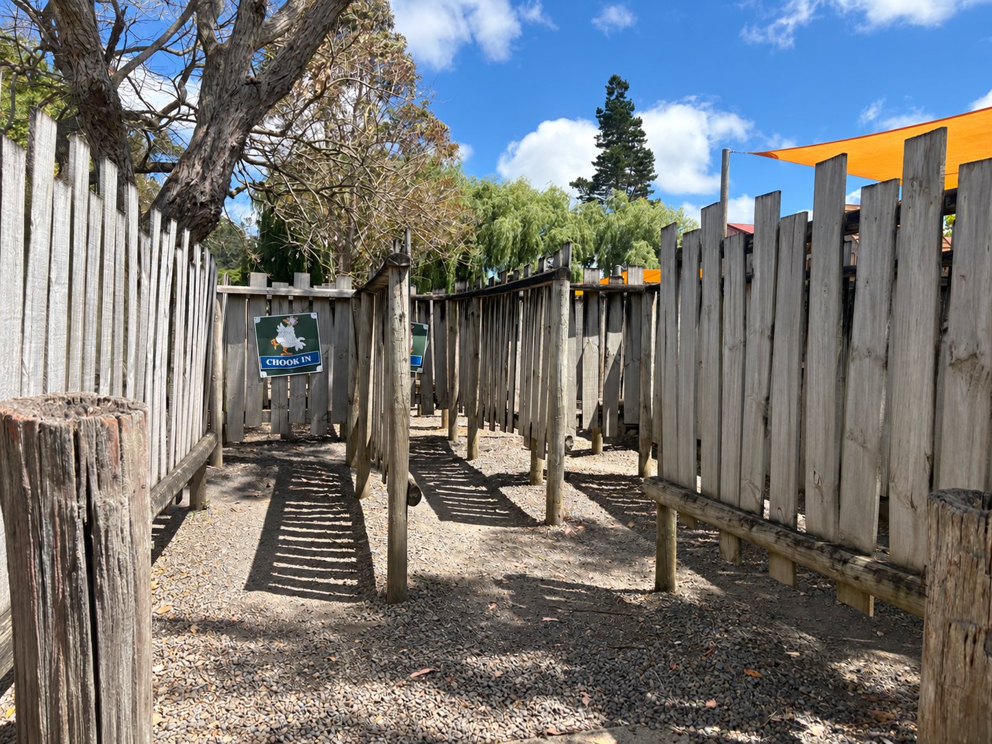 The wooden maze, with a Chook In sign on the fence